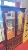 Mahogany-finish glazed display cabinet with drawers