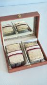 Pair of silver-plated engraved dressing brushes in fitted case