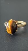 9ct Gold ring set with tigers eye Weight 3.3g Size