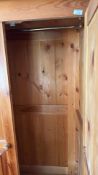 Pine wardrobe, moulded cornice above twin panelled doors with knob handles, full-width lower drawer,