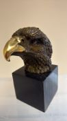 Bronze eagle head on marble base