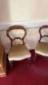 Pair of mahogany balloon-back side chairs, mid-19th century, the scroll-carved backs with