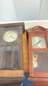 Pair of wooden cased pendulum wall clocks