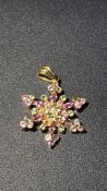 9ct Gold snowflake pendant set with pink and yello