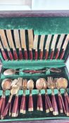 Cased cutlery service with rosewood and brass handles
