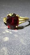 9ct Gold ring set with garnet solitaire Weight 2.9