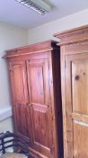Pair of pine two-door wardrobes