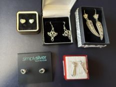 5 Pairs of silver earrings