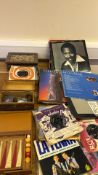 Assorted records, coin-filled boxes and backgammon set