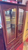 Glazed wood display cabinet with drawers