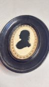 Oval framed silhouette signed