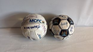 Two Manchester City FC autographed footballs
