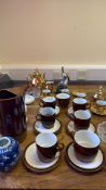 Group of Poole Pottery coffee ware, gilt porcelain tea ware and porcelain figure