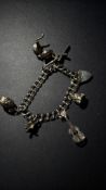 Silver charm bracelet with 6 charms Weight 36g