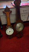 Pair of carved oak wall barometers