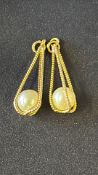 Pair of yellow metal earrings set with pearls