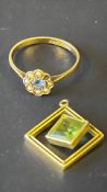 9ct Gold ring set with central blue stone surround