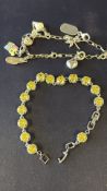 Silver bracelet with yellow stones & silver charm