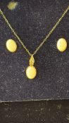 9ct Gold chain pendant & earring set, set with opa