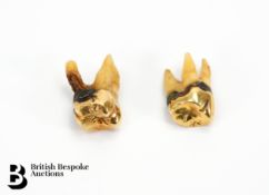 Two 18ct Gold Capped Molars
