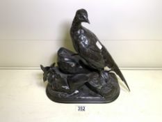 A BRONZE SCULPTURE OF A PHEASANT ON A ROCKY OUTCROP, IMPRESSED SIGNATURE J. MOIGNEIZ, HEIGHT 33CM