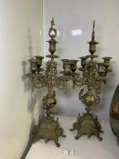 A PAIR OF VINTAGE FIVE LIGHT BRASS CANDLEABRA, DECORATIVE BORDERS, SCROLL ARMS, KNOPPED STEM FLANKED