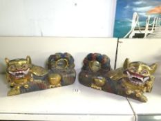A PAIR OF PAINTED CARVED WOOD FOO DOGS, LENGTH 36CM
