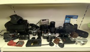 QUANTITY OF USED CAMERAS AND ACCESSORIES INCLUDES CANON, PENTAX AND MORE