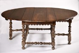 A large demi-lune flap table with six legs