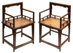 A pair of Chinese hardwood armchairs