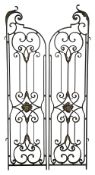 A pair of wrought iron garden gates
