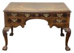 A William & Mary style walnut and laburnum oyster veneered kneehole desk or writing table