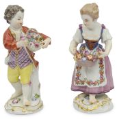 A pair of late 19th century Meissen polychrome porcelain figures