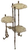 A late 19th century brass three tiered plant stand