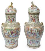 A large pair of 19th century Chinese Canton famille rose vases and covers