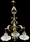 An Arts and Crafts brass ceiling light in the manner of W A S Benson