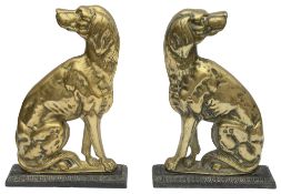 A pair of Victorian brass and cast iron doorstops