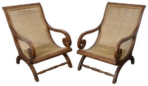 A pair of mid 20th century colonial planter chairs