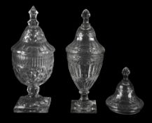 A George III cut glass urn and cover and another later urn