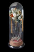 A large Victorian featherwork floral display under dome