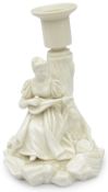 A Royal Worcester blanc-de-chine figural candlestick, late 19th century