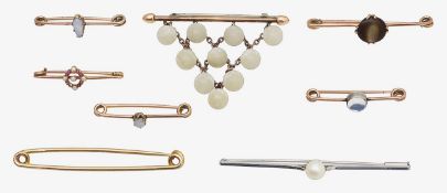Eight mostly 19th century gem-set brooches