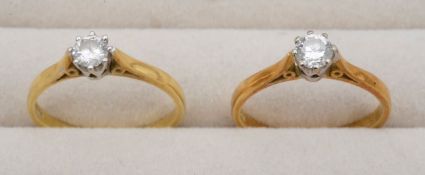 Two 18ct diamond set solitaires