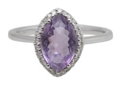 An 18ct amethyst and diamond ring