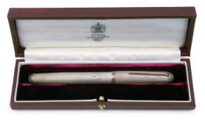 A cased Apsrey engine turned silver fountain pen