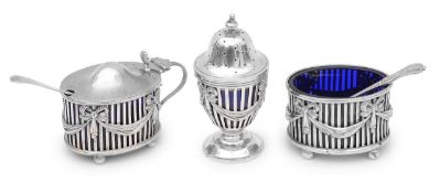 An Edwardian silver Neoclassical design three piece cruet set