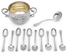 A George V Arts and Crafts silver porringer and a assorted coffee spoons