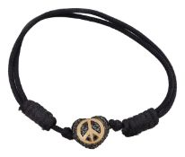 An 18ct white gold and blue pave set sapphire Theo Fennell heart shaped peace charm on leather strap