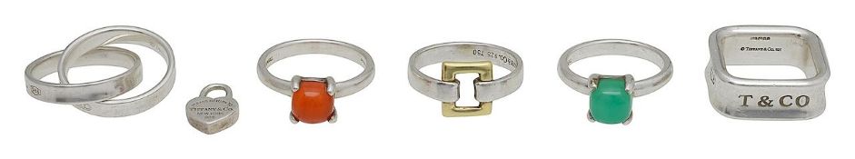 A collection of Tiffany rings and a small tag heart