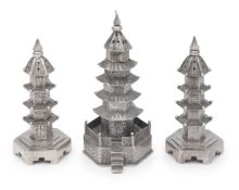 A pair of Chinese export .900 silver novelty pagoda pepperettes